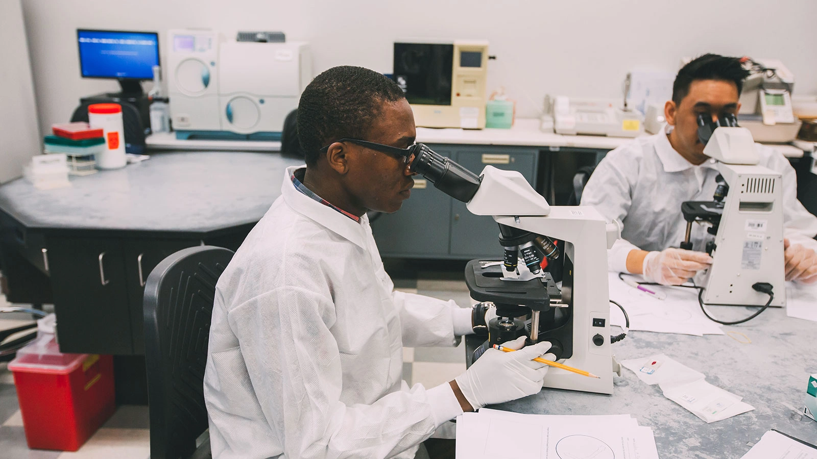 Student looking through a microscope
