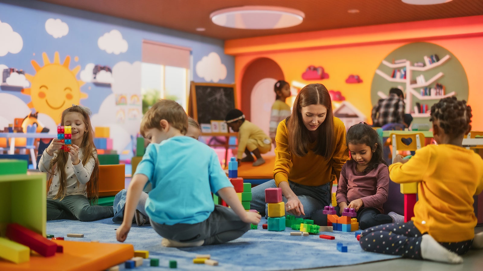 Children playing with blocks on the floor