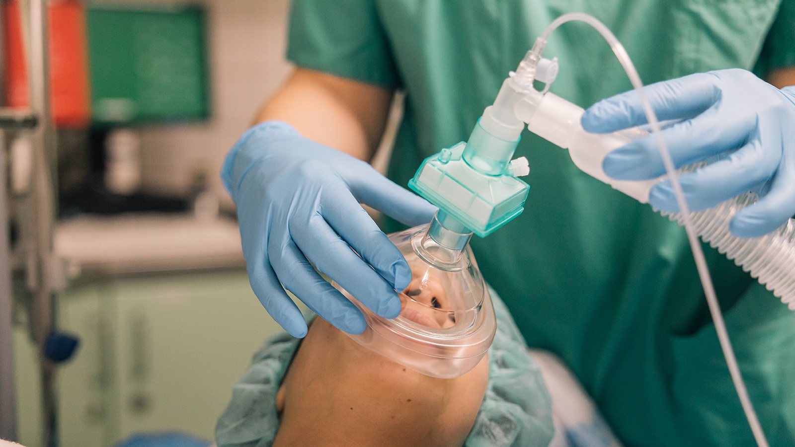 Anesthesiologist prepping a patient for surgery