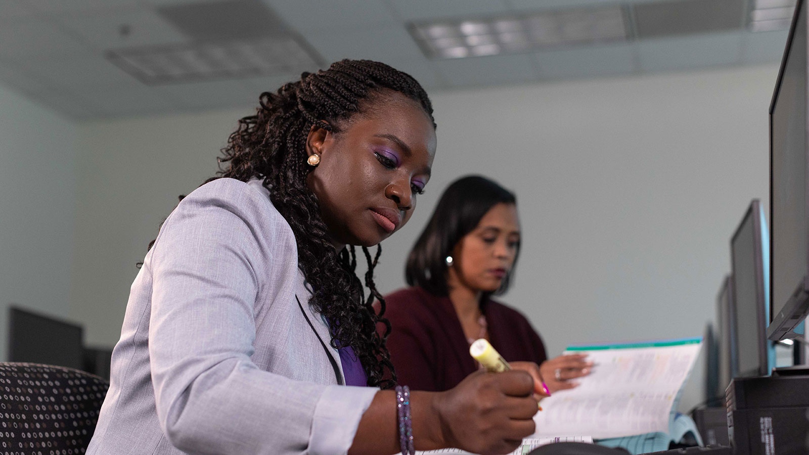 Two women looking over paperwork