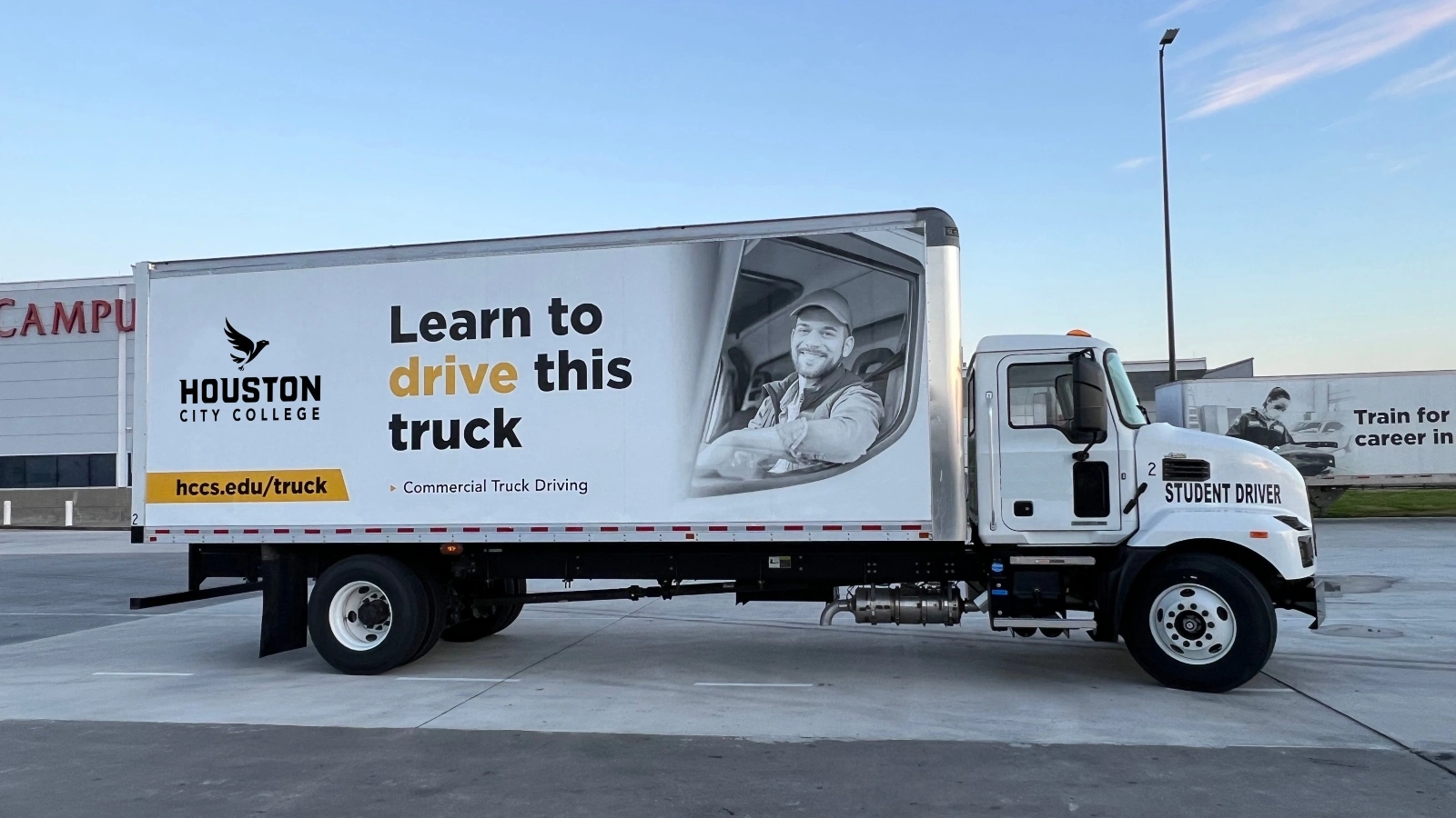 A Commercial Truck Driving vehicle sits parked at an HCC campus.