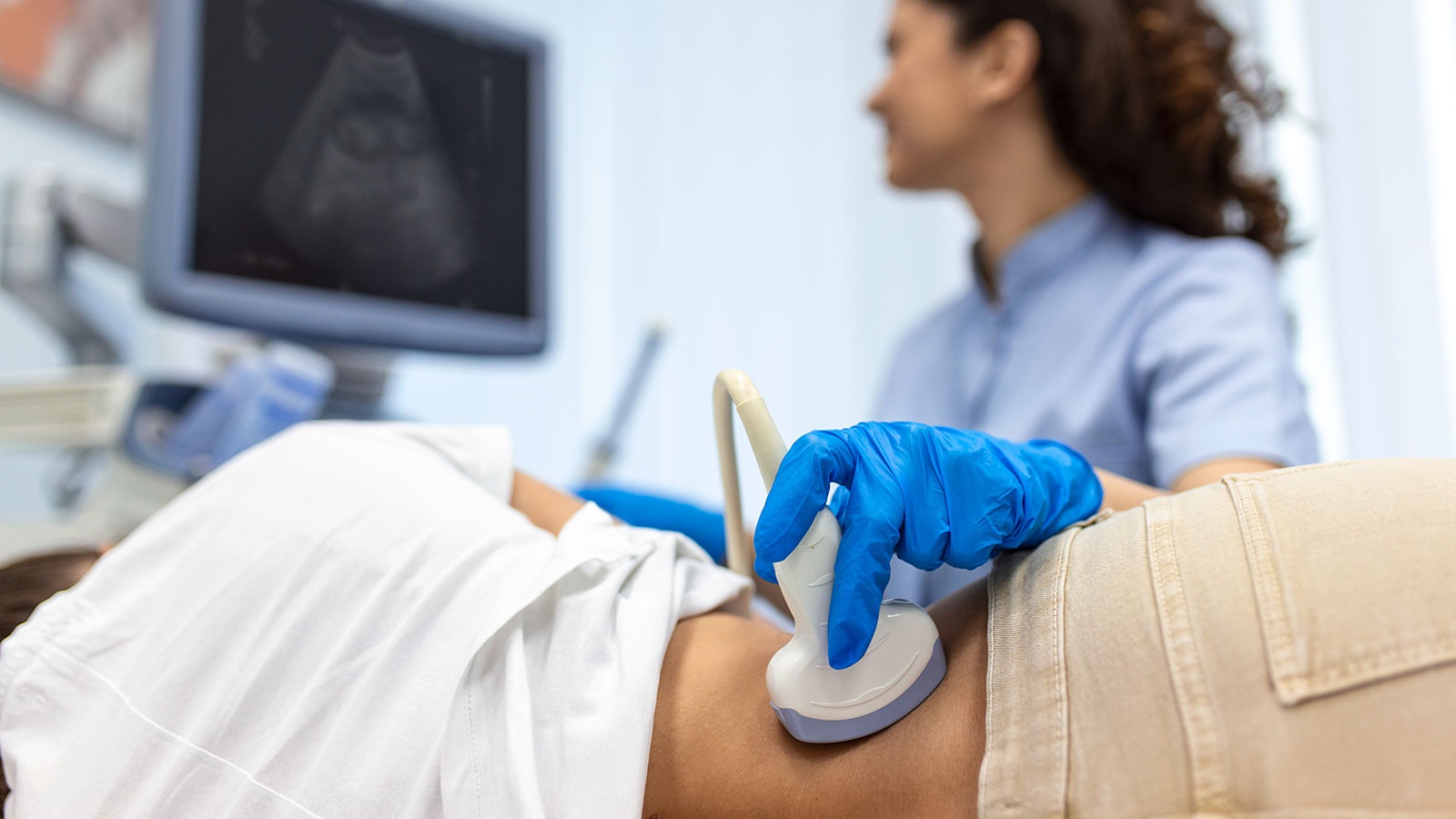 Diagnostic Medical Sonography Instructor in the process of doing a sonography examination.