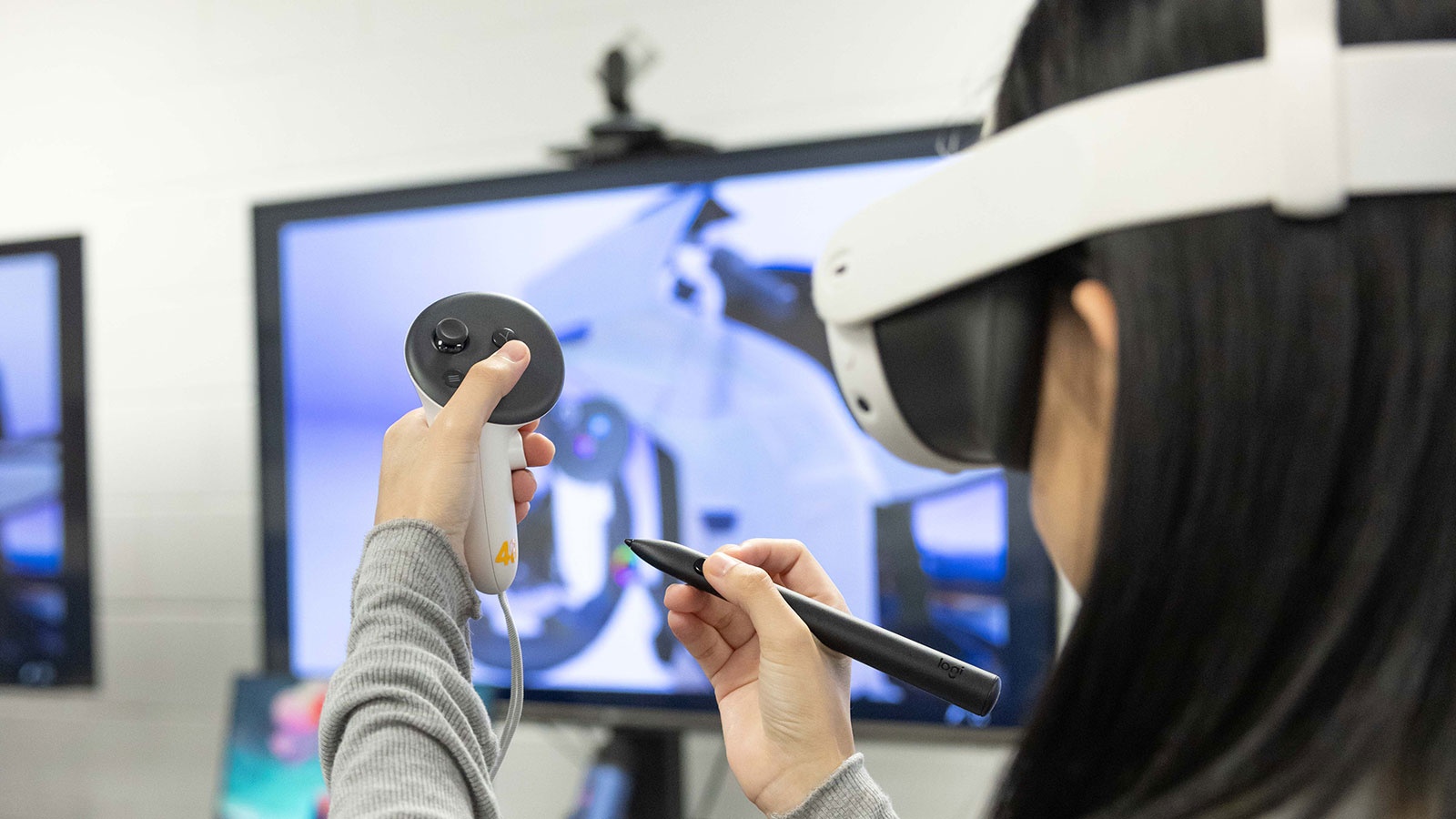 Student testing a 3d simulation using a VR headset