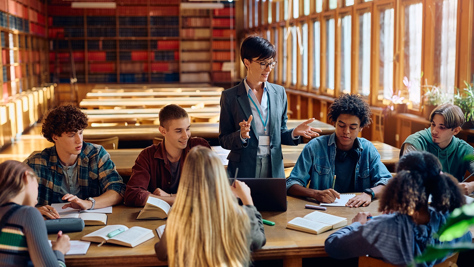 A group of students in class with their professor.