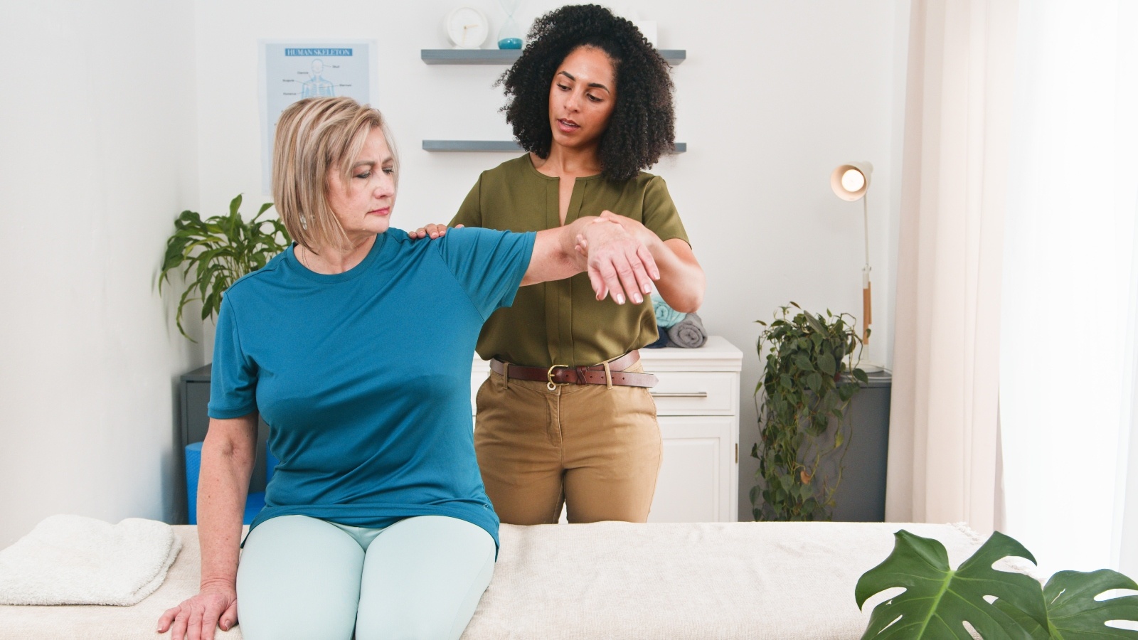 Physical Therapist Assistants helping a patient during a PT session