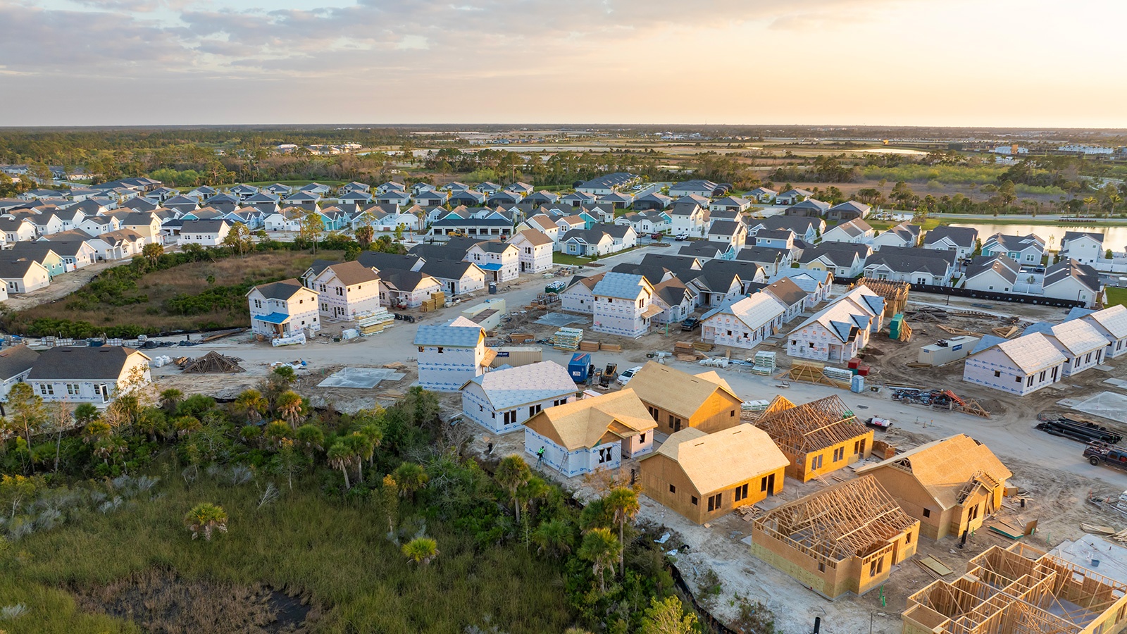 houses under construction in new developing suburban area