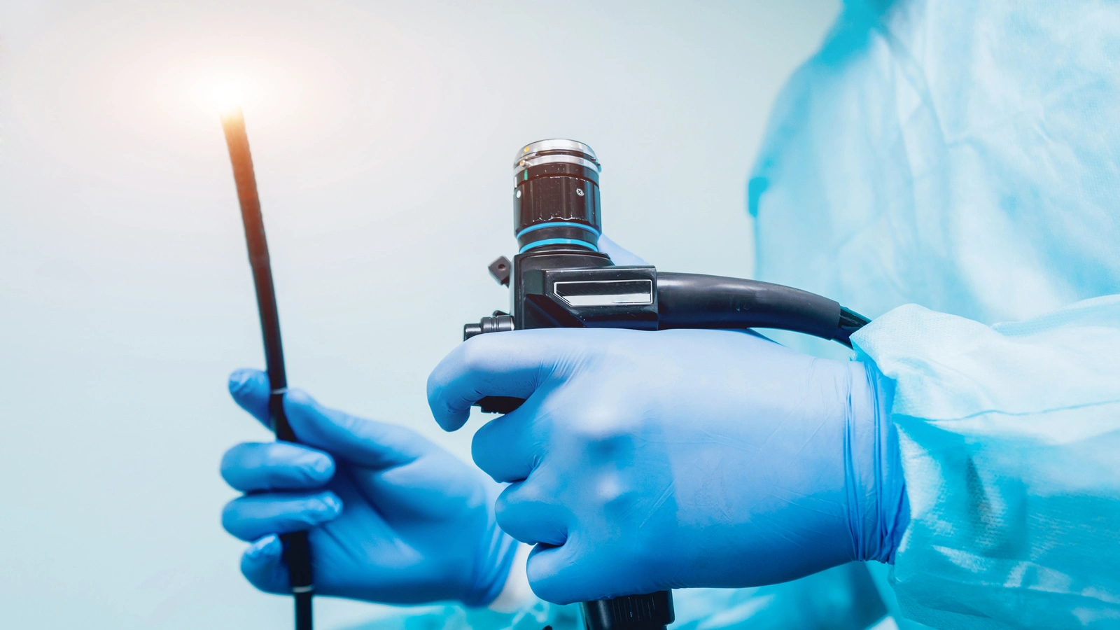 An Endoscopy Technician holding an endoscope