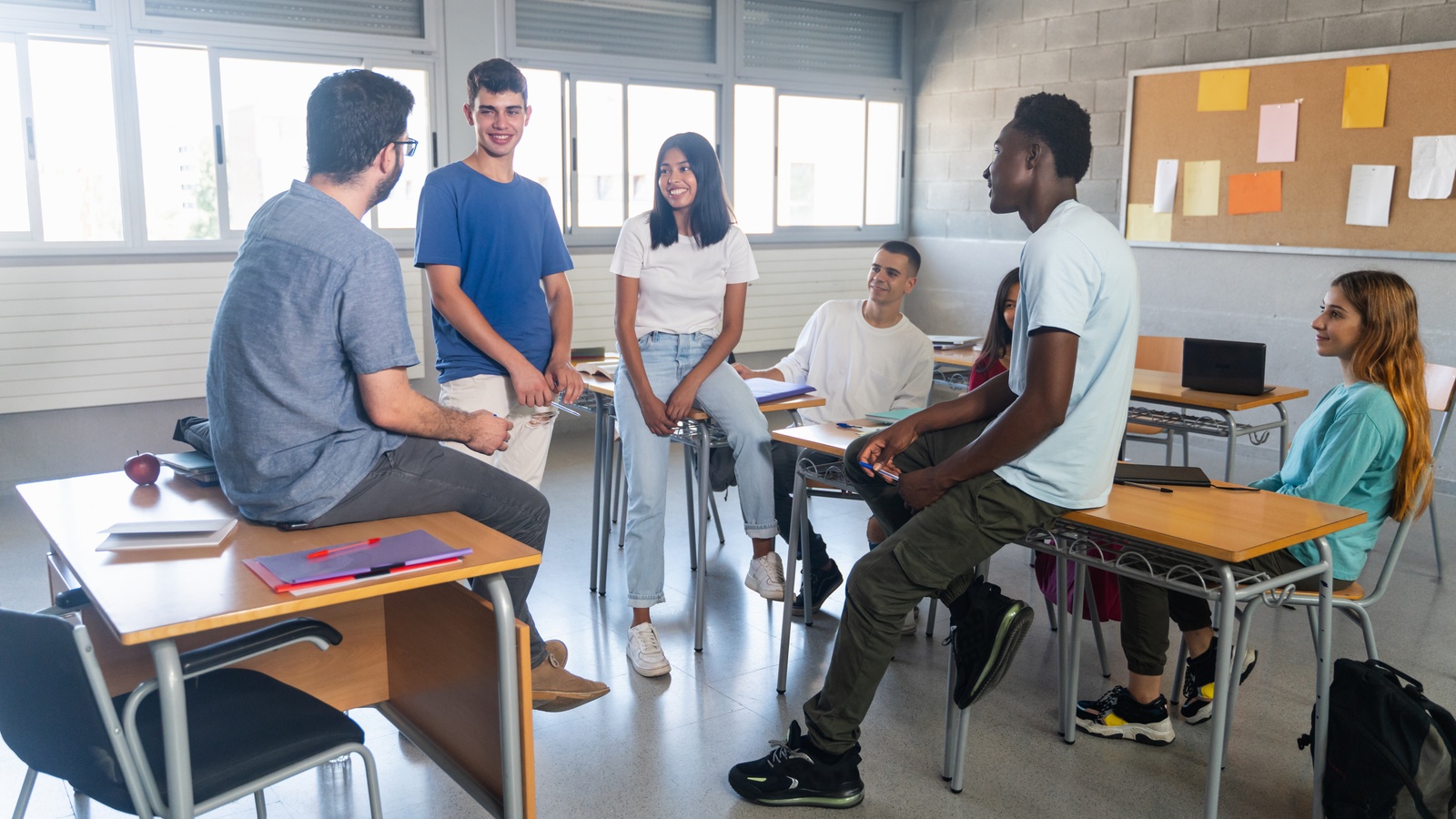 A group of students in class with their professor.