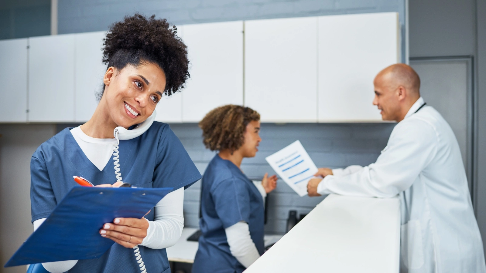 Doctor talking to a nurse.