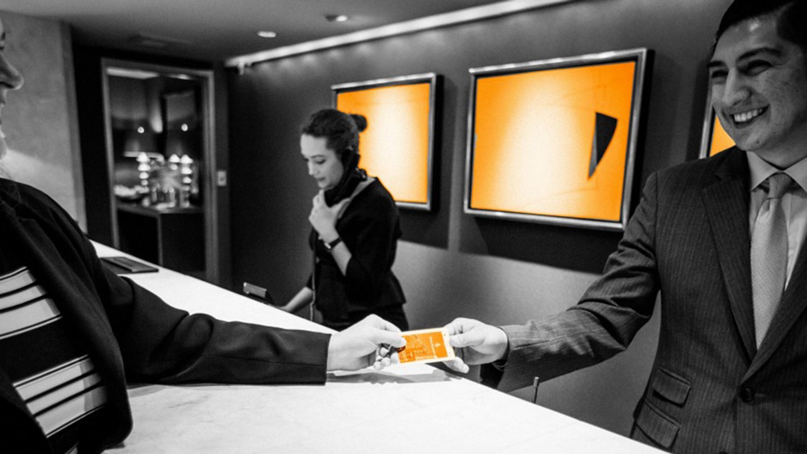 Hotel receptionist greeting a guest
