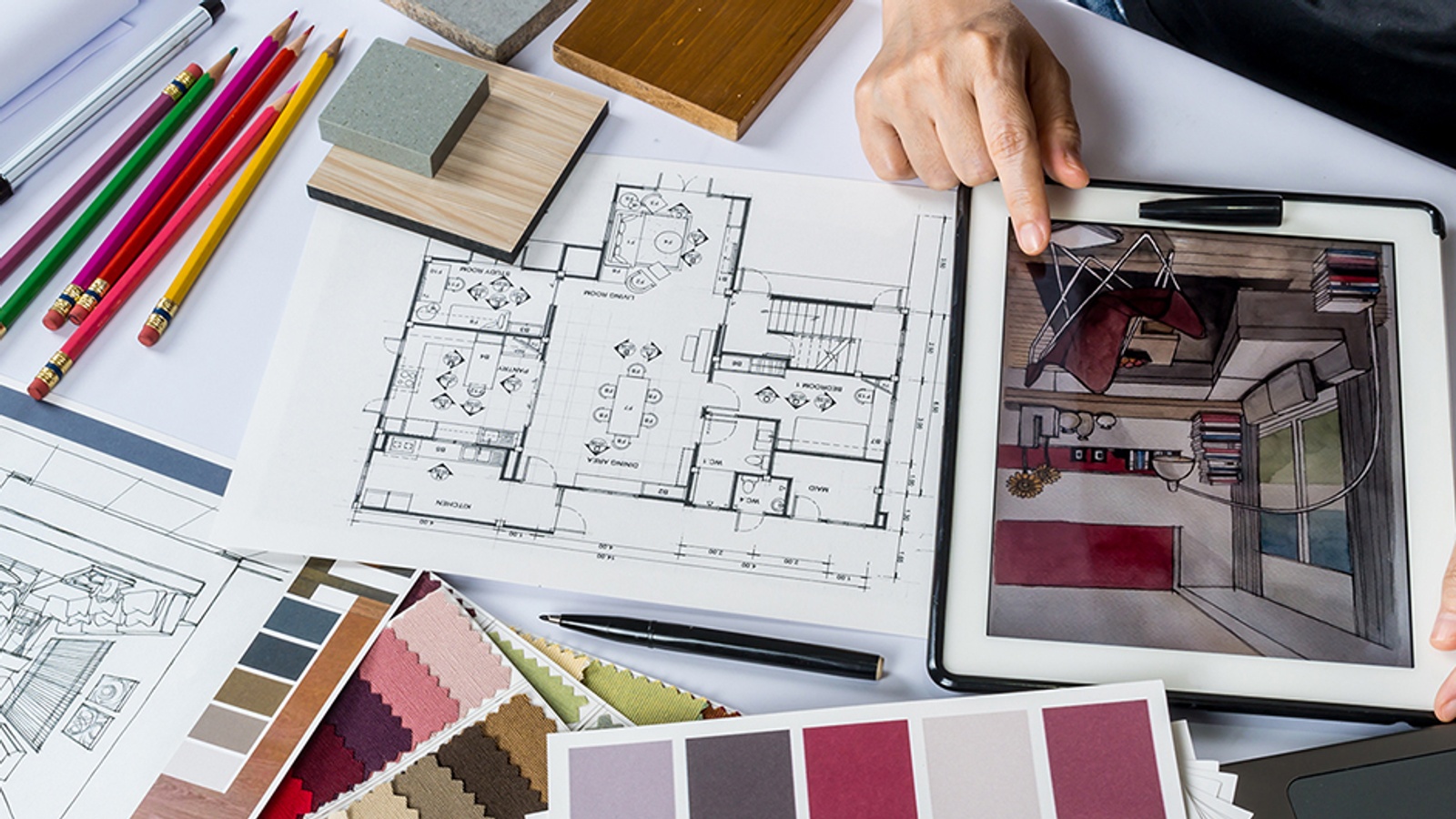 Blueprints and 3D renderings of a living space surrounded by paint color and fabric swatches.