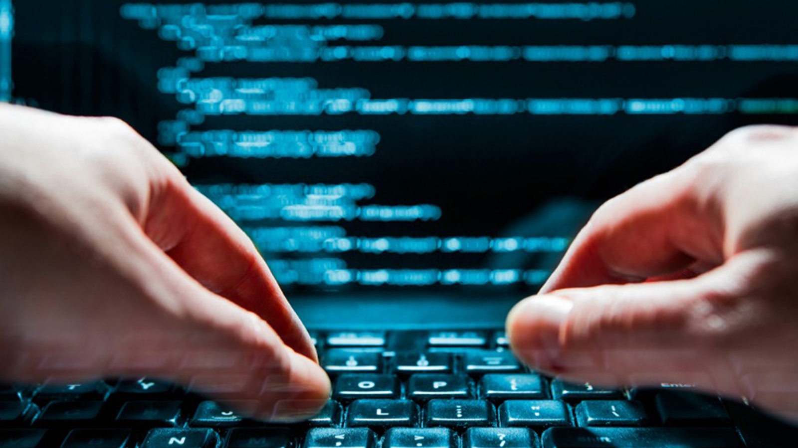 Computer programmer writing code