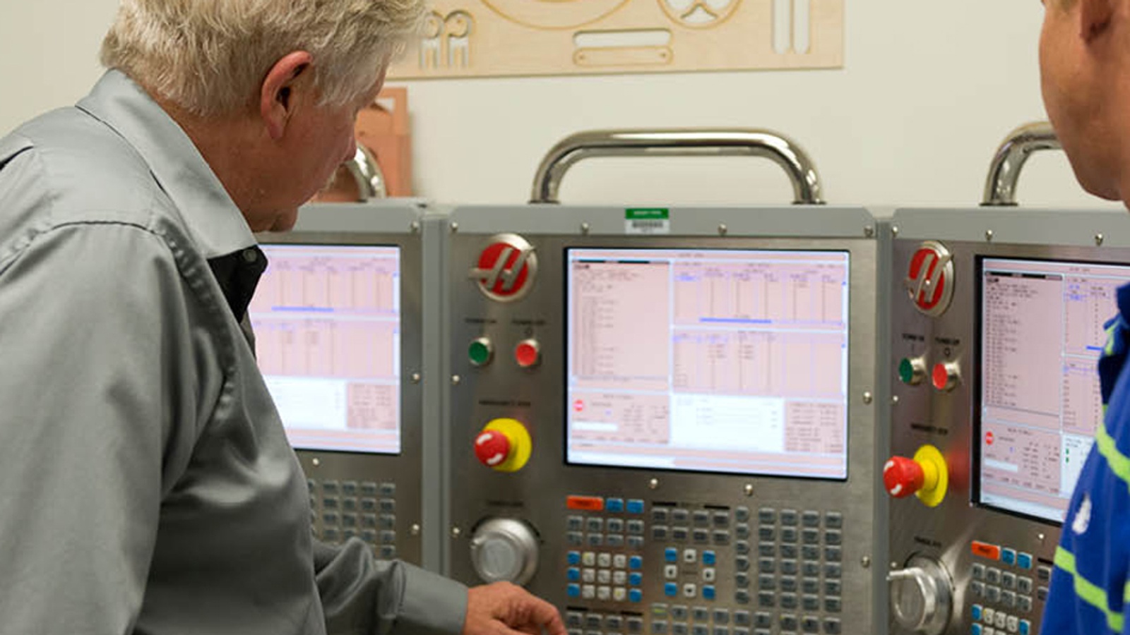 Engineers monitoring a control panel