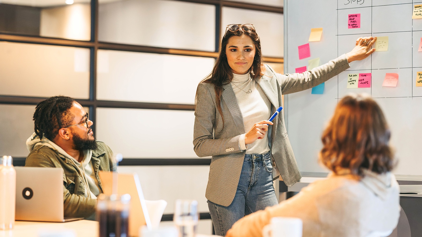Scrum master engaging her business team in effective project management during a meeting