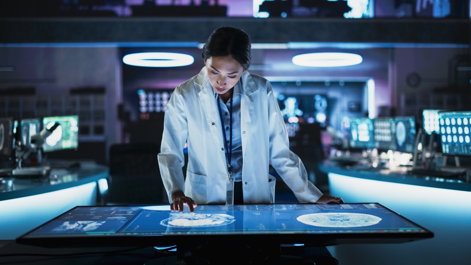 Doctor looking at a patients scans on the computer.