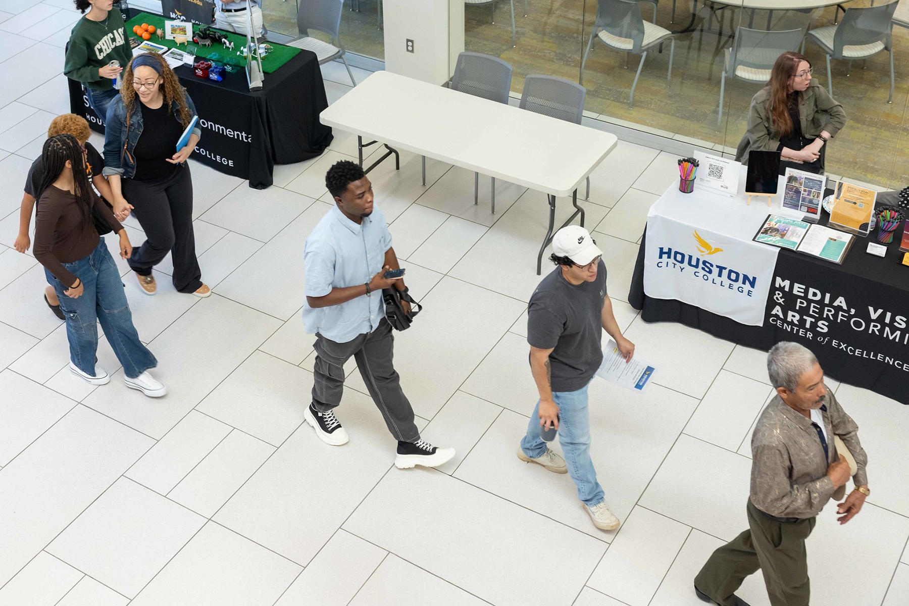 HCC Students walking in the hall way of a campus
