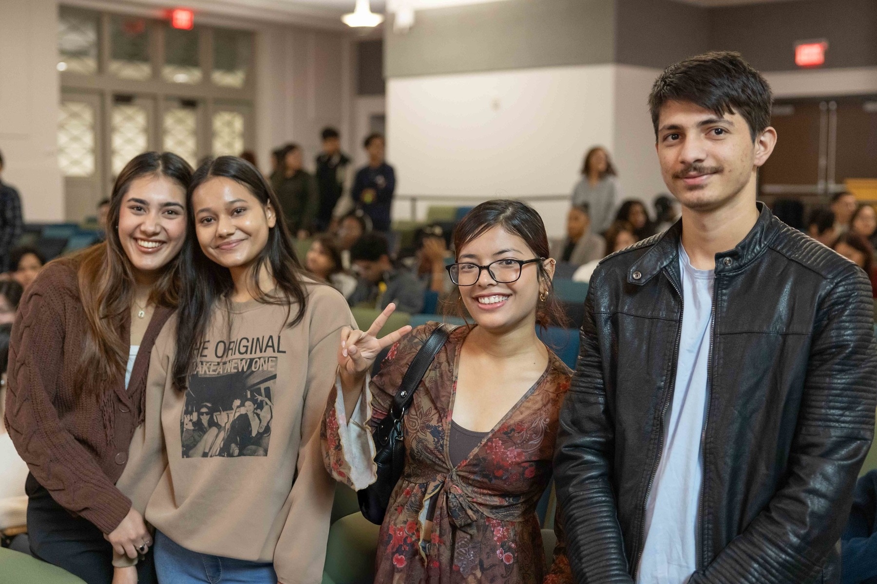 HCC International Students smile while taking a photo.