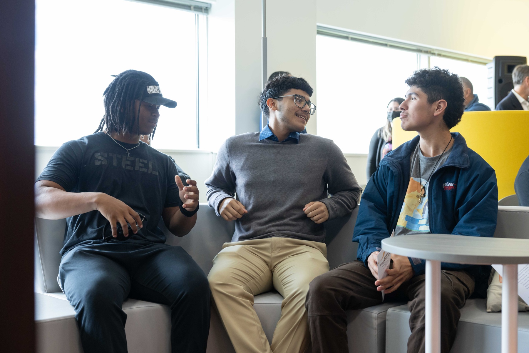 Students conversing in the lobby
