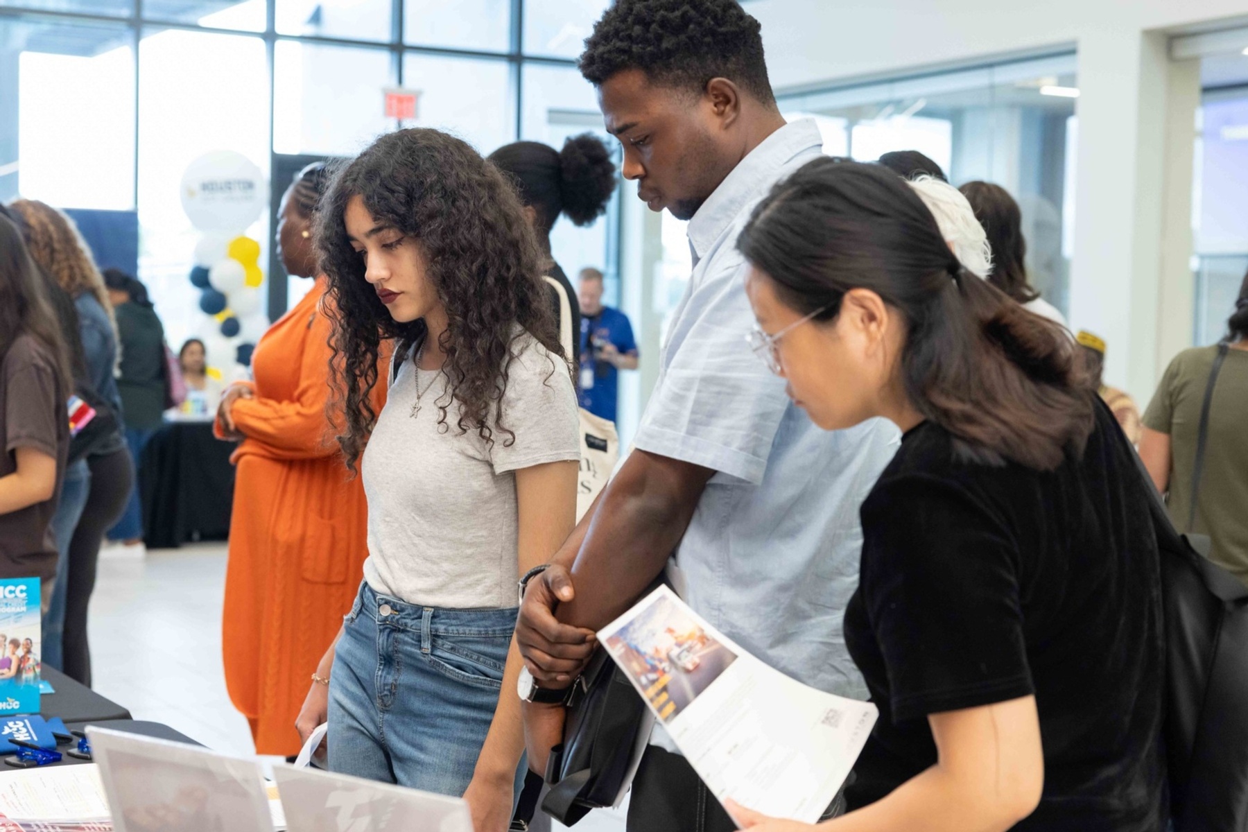 Students receiving information from staff. at Eagle Preview Day