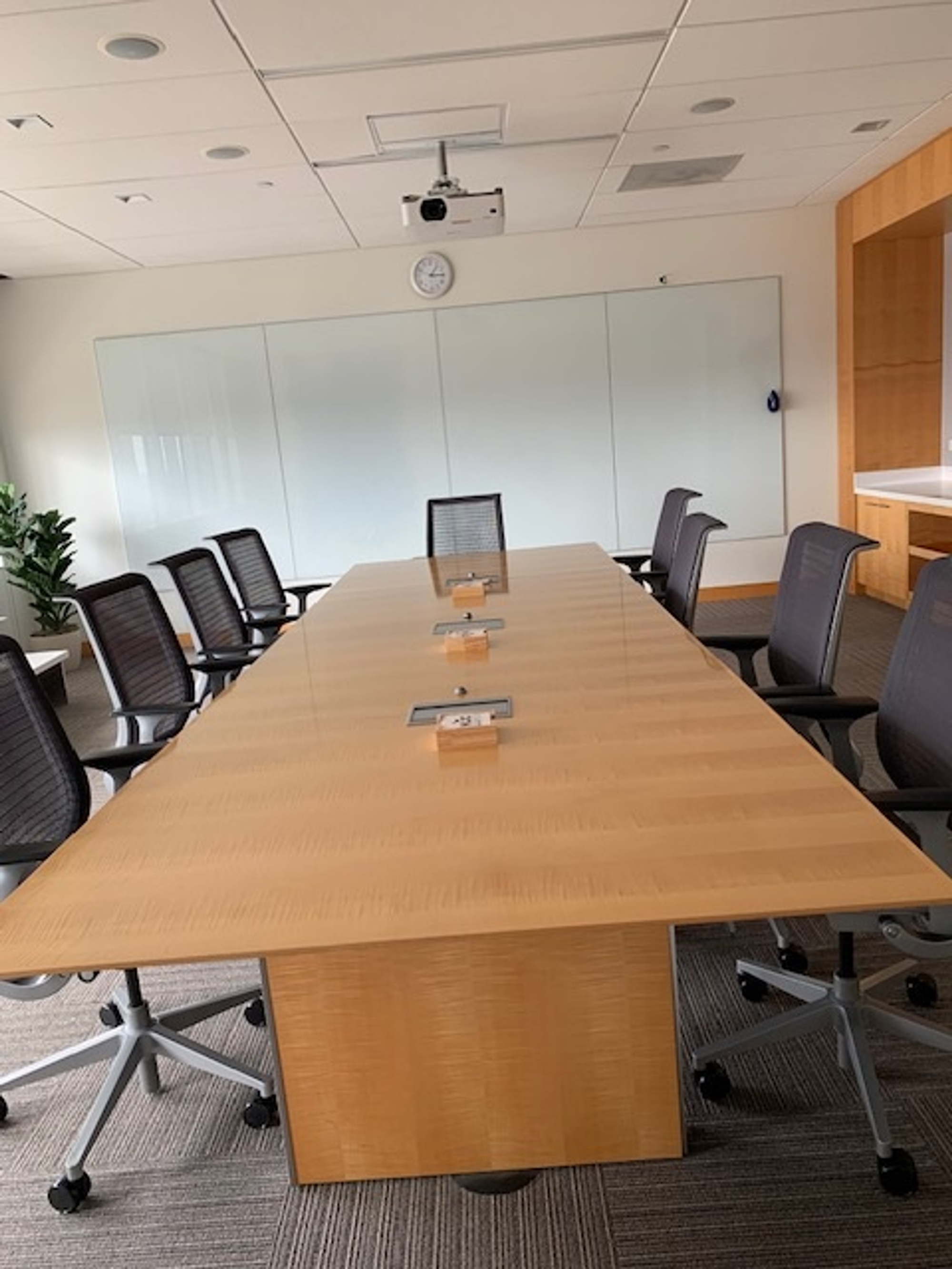 Closer photo of the deskspace and chairs in the Arctic Ocean Conference room