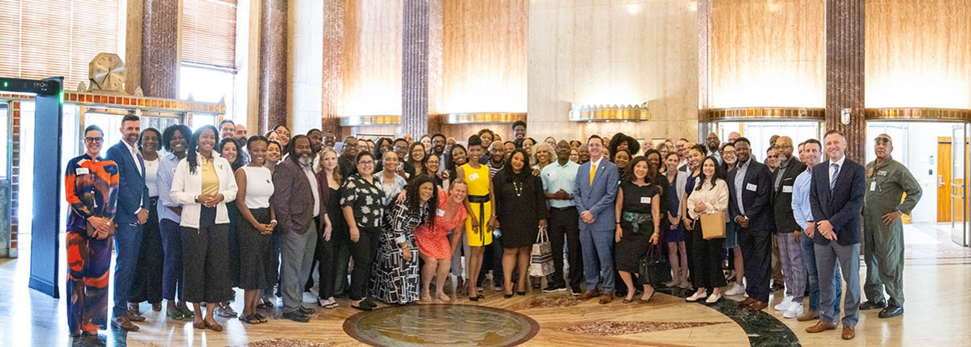 A large group of people pose for a photo.
