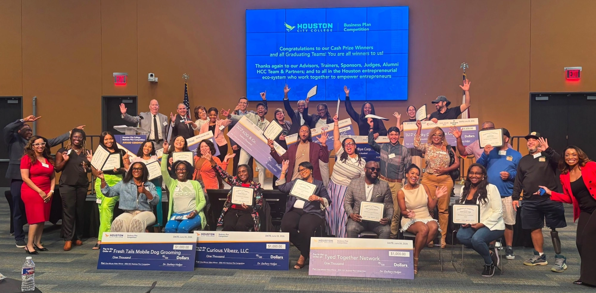 Graduates of the 2026 HCC Business Plan Competition pose for a group photo during the graduation ceremony.
