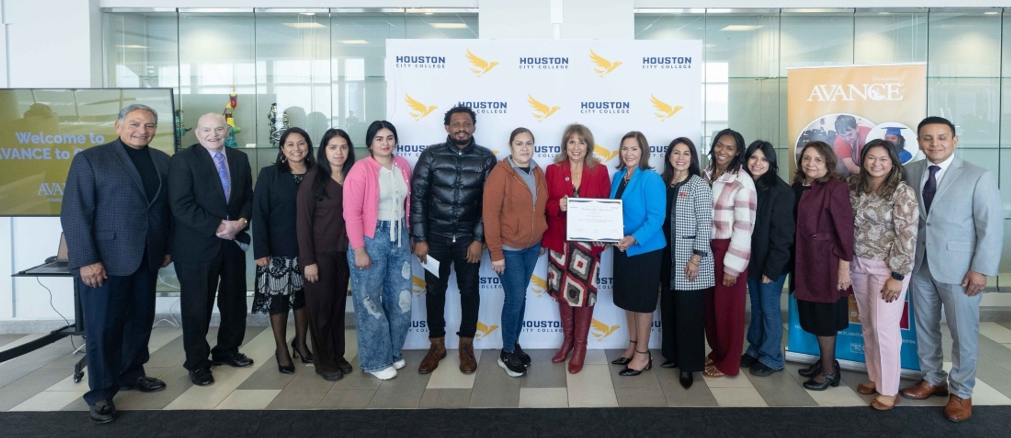 Pictured from left to right: John Cisneros, HCC Southeast President's advisory committee member; Bob McAllister, Ph.D., former AVANCE-Houston board member; Anna Lisa Williford, director, AVANCE for College; AVANCE-Houston students; Frances Villagran-Glover, D.A., HCC Southeast president; Luz Flores, executive director, AVANCE-Houston; Claudia Ortega Hogue, AVANCE-Houston board member; more AVANCE