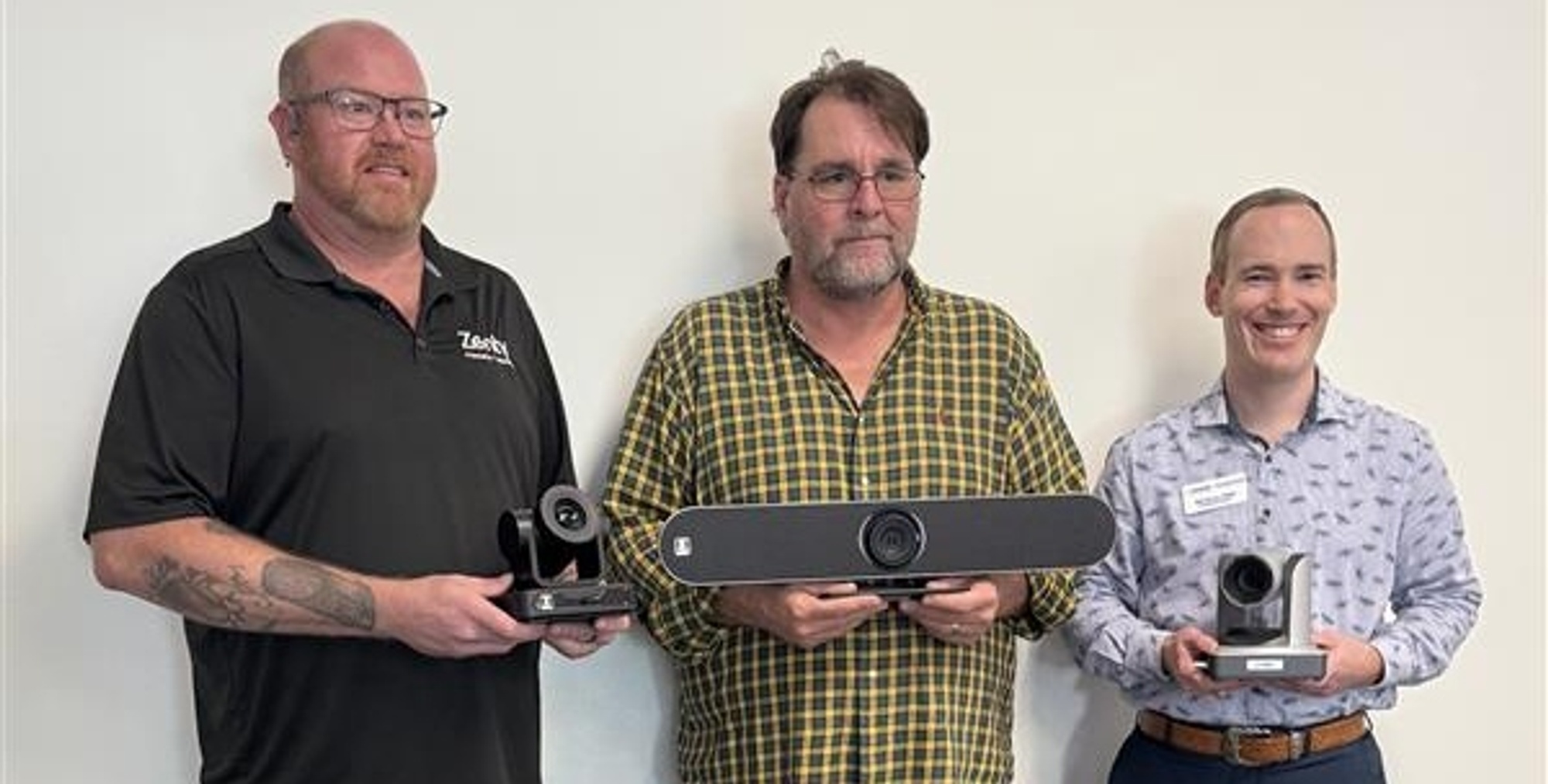 From left to right, Adrian Wagner, director of Sales & Support, J-Tech Digital; Matt Adams, program coordinator, Smart Building Technology program and Will Horton, HCC Foundation development director pose with PTZ cameras donated to the college in support of the Smart Building Technology program.
