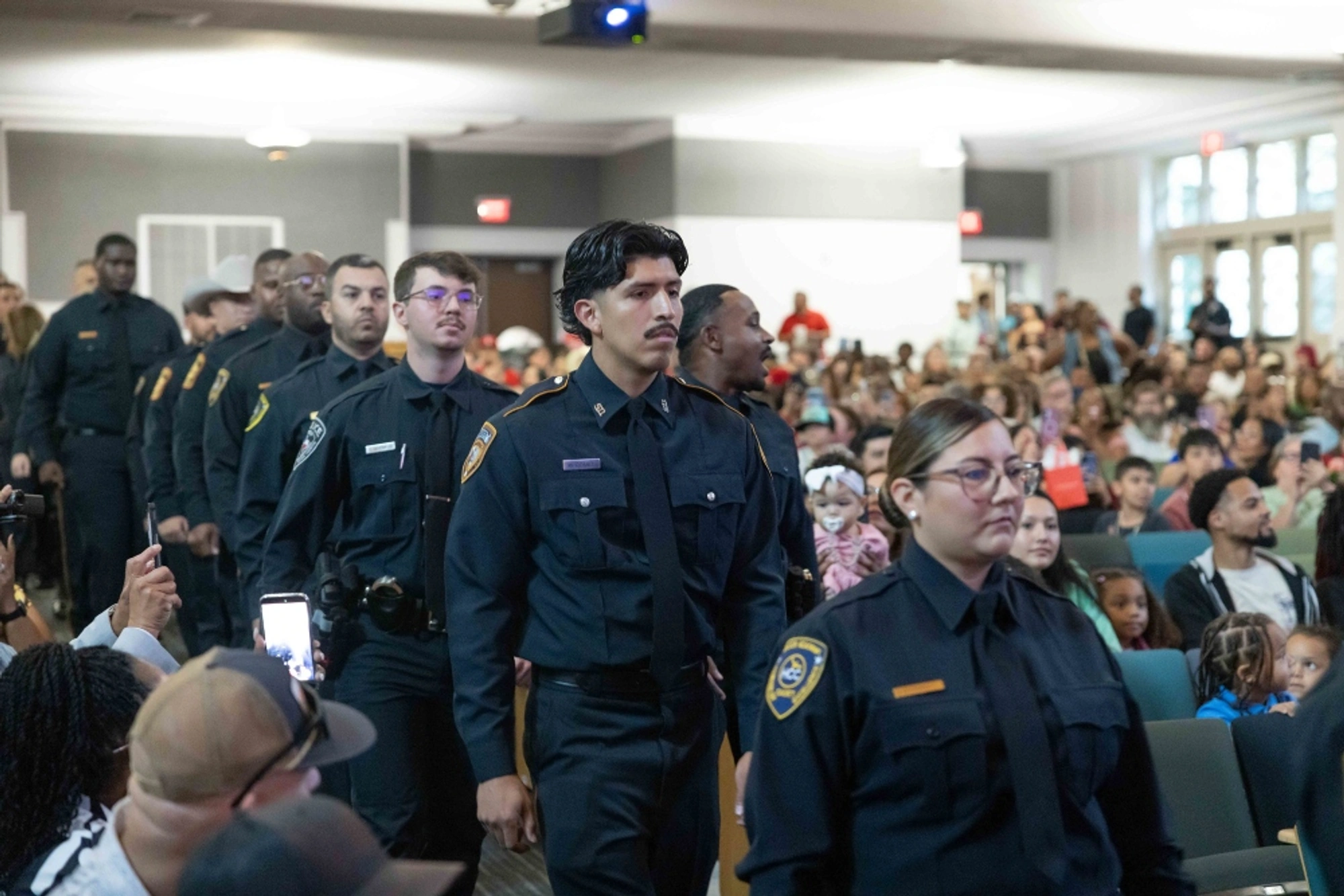 HCC law enforcement cadets attend a graduation ceremony.