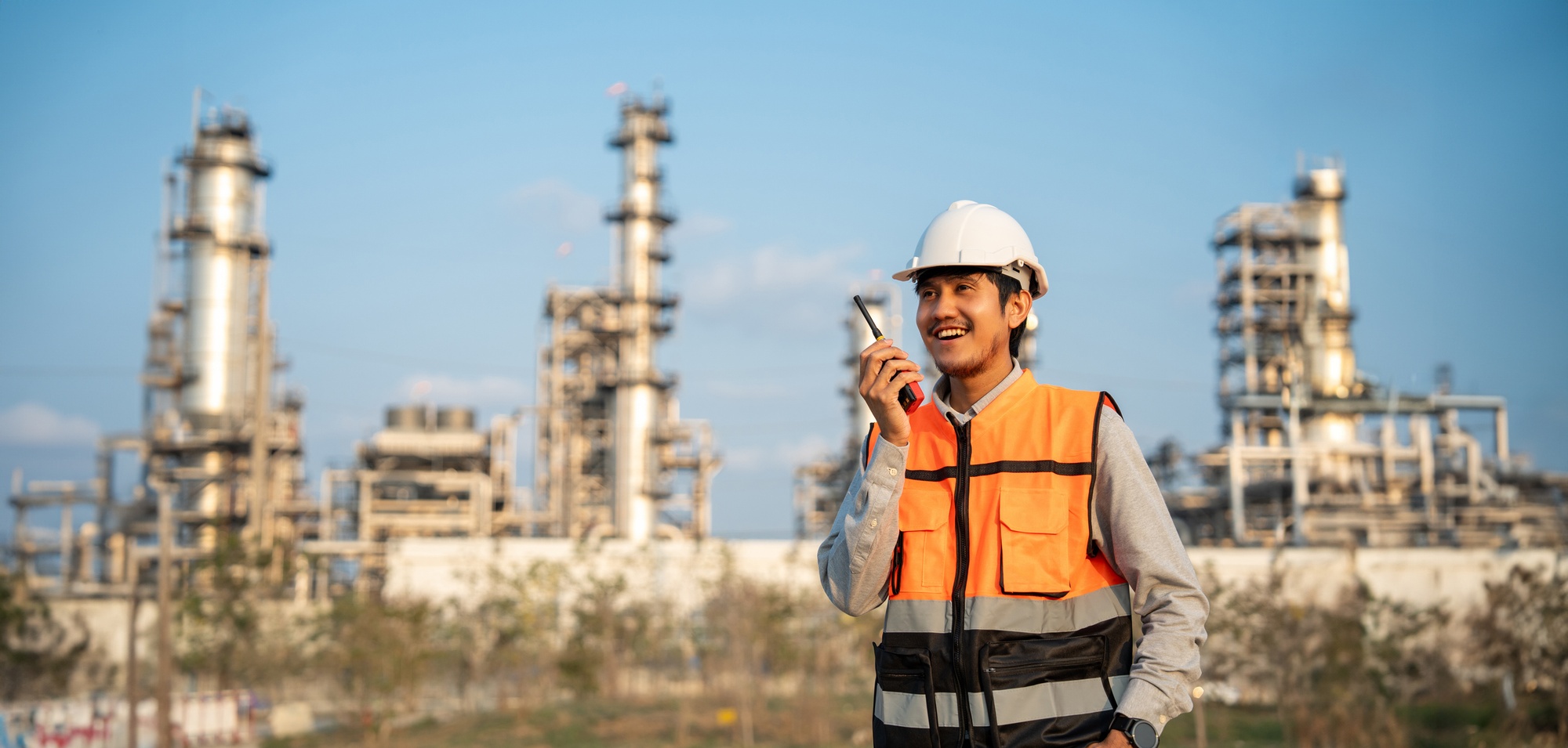 Petroleum Engineer standing in front of a refinery