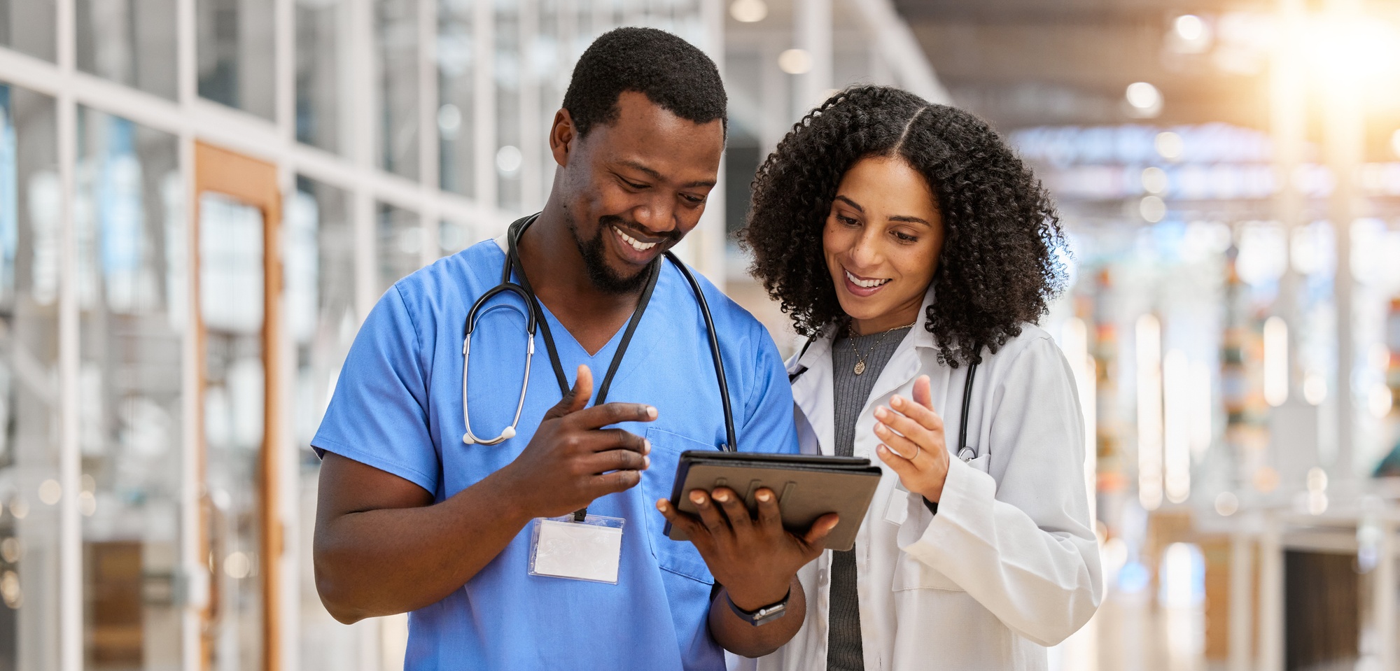 Two Healthcare professionals viewing a tablet