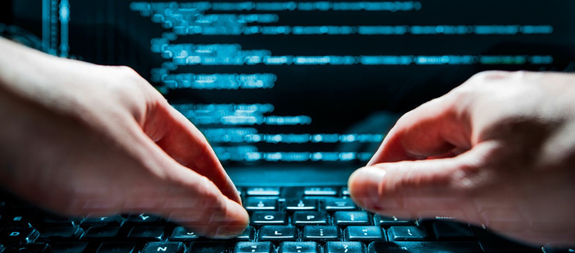 Programmer writing code on a computer