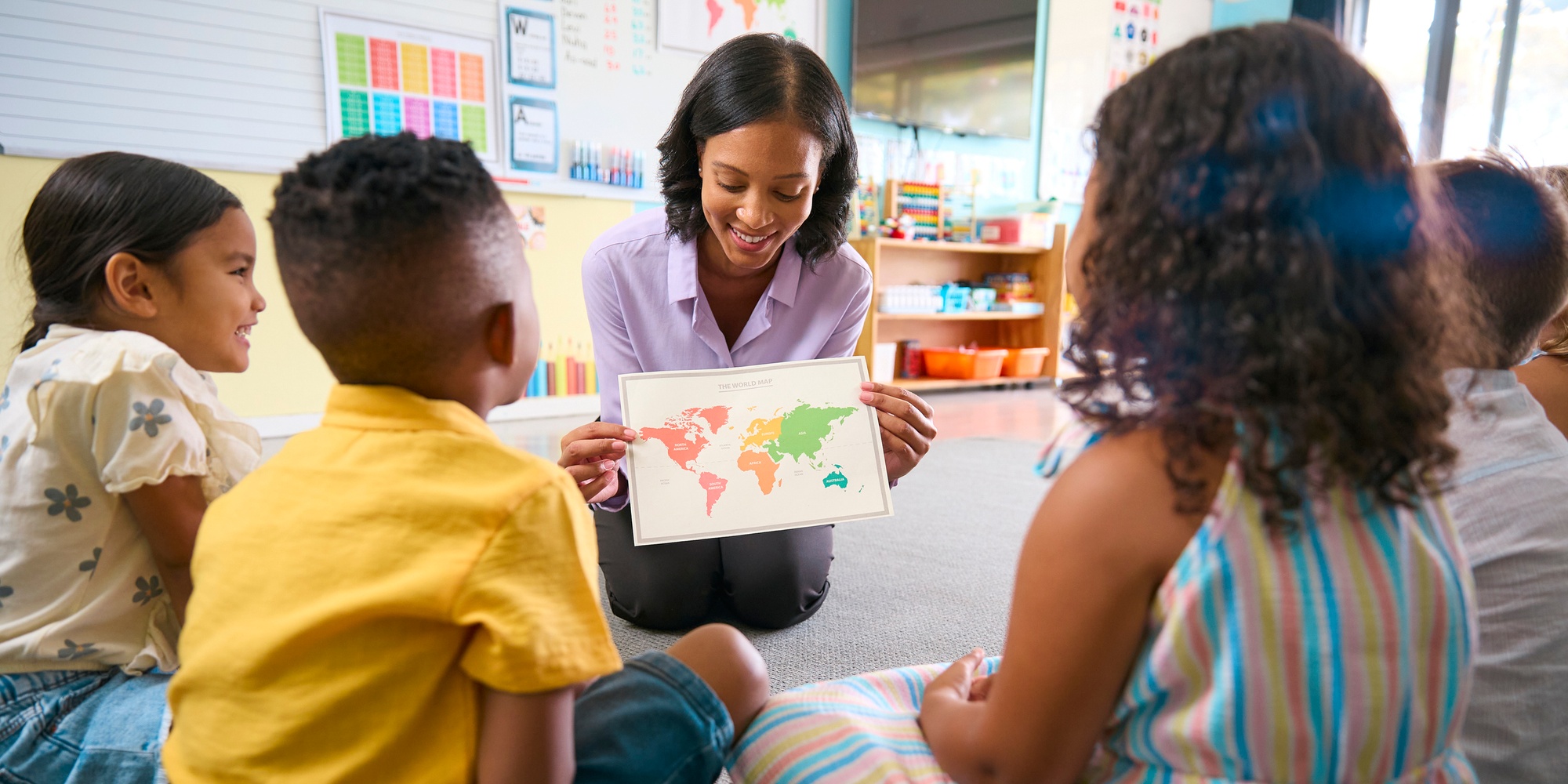 Teacher interacting with elementary school students