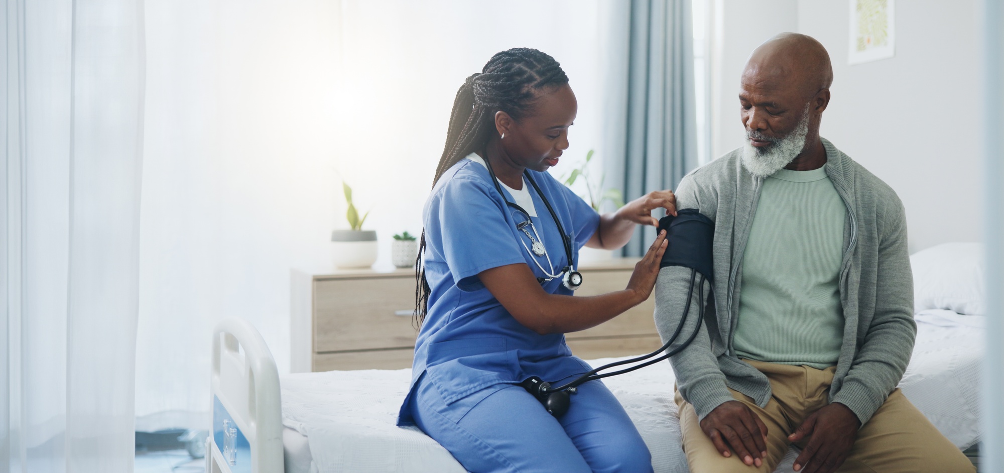 Medical Assistant measuring a patients blood pressure