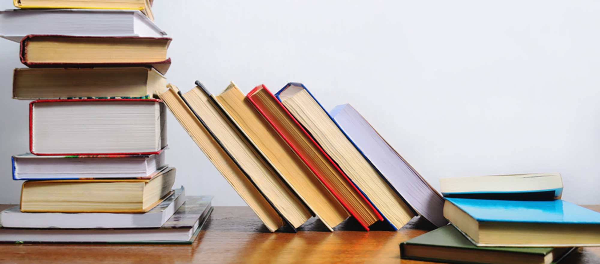 A stack of books on a table or desk.
