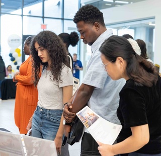 Students receiving information from staff. at Eagle Preview Day