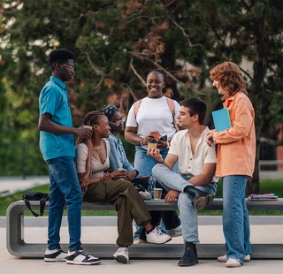Students socializing in the courtyard of a campus