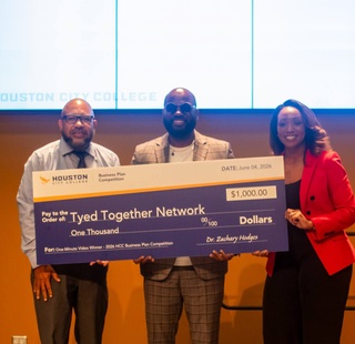 1 Minute Video Competition, Tyvarion Malone, receiving award.