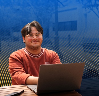A HCC student using his laptop