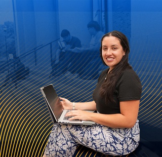 Female HCC student using her laptop