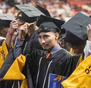 HCC graduates move their tassels during the Commencement Ceremony.