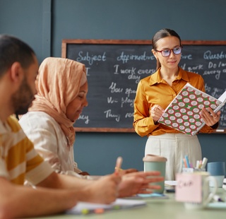 ESL students learning english sentence structure in the class room