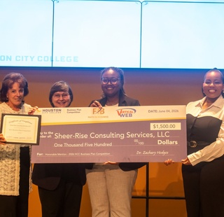 Business Plan Competition Honorable Mention – Sheer-Rise Consulting Services, LLC Feyisetan Akeredolu receiving her award