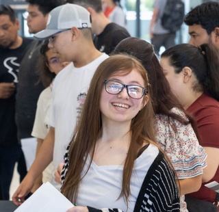 An HCC student smiles while attending an event at the HCC Northwest College.
