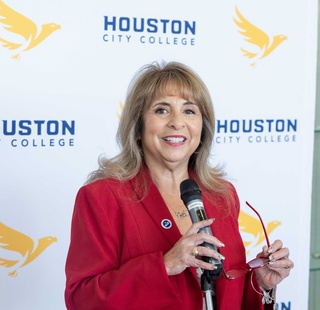HCC Southeast College president Frances Villagran-Glover smiles during an event.
