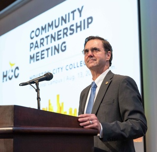 HCC Southwest College president Michael Webster looks on during an event.