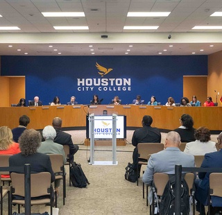 The HCC Board of Trustees conducting a meeting