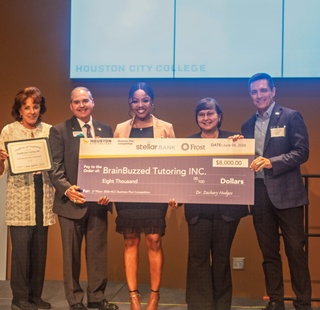 Business Plan Competition 2nd place winner Patience Edwards receiving her award