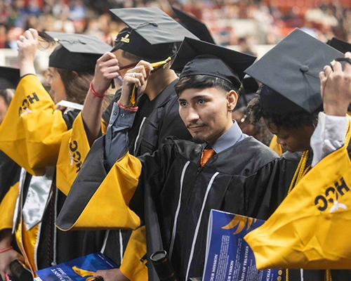 HCC graduates in their regalia at commencement