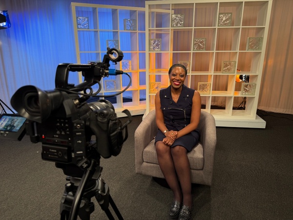 Brittaney Wilmore sits in a TV studio